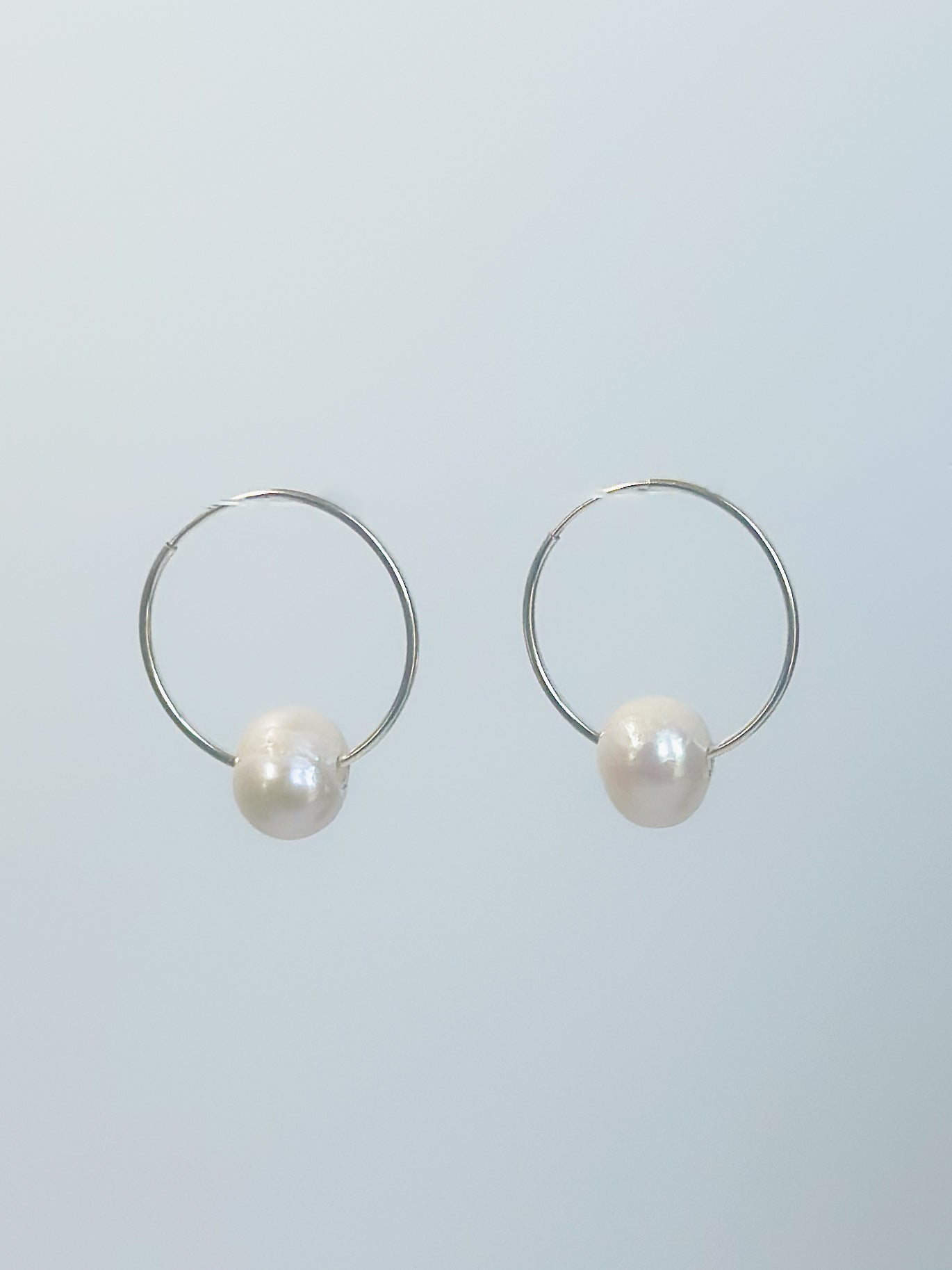 Sterling silver endless hoop pearl earrings